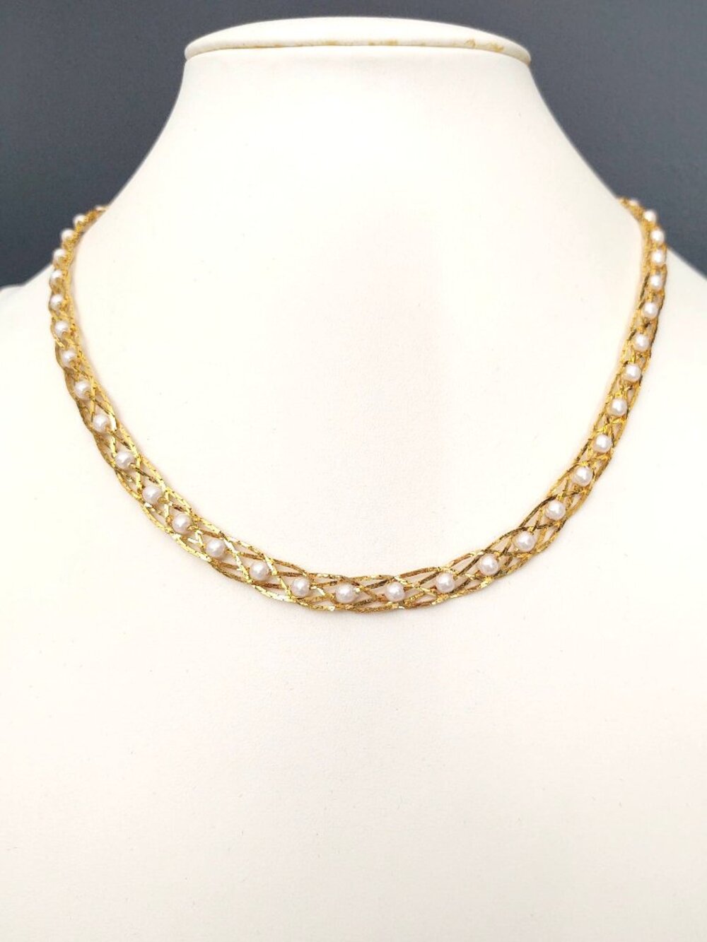 Delicate gold tone woven necklace with tiny faux pearls